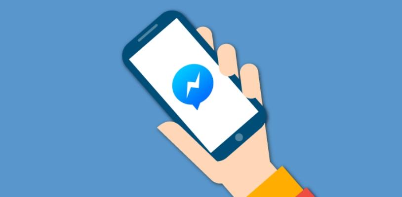Logotipo de Facebook Messenger en un smartphone con fondo azul